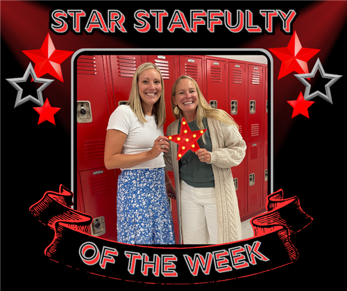 Two blonde ladies smile while holding a red star with yellowish lights lit up on it. 